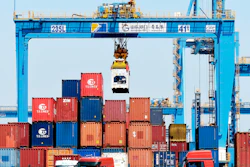 A gantry crane moves containers at a port in Qingdao in eastern China's Shandong province Friday, June 4, 2021. China's exports surged nearly 28% in May while imports jumped 51% as demand rebounded in the U.S. and other markets where the pandemic is waning, though growth is leveling off after a stunning recovery from last year's slump.