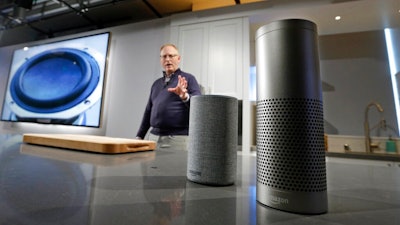 David Limp, senior vice president of Devices and Services at Amazon, displays a new Echo, left, and an Echo Plus during an event announcing several new Amazon products by the company, Wednesday, Sept. 27, 2017, in Seattle. On Tuesday, June 8, 2021 Amazon launched a program that forces users of many Echo smart speakers and Ring security cameras to automatically share a small portion of their wireless bandwidth with neighbors. The only way to stop it is to turn it off yourself.