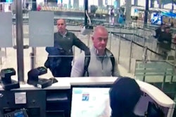 This Dec. 30, 2019 image from security camera video shows Michael L. Taylor, center, and George-Antoine Zayek at passport control at Istanbul Airport in Turkey. Americans Michael Taylor and his son Peter Taylor go on trial in Tokyo on Monday, June 14, 2021, on suspicion they helped Nissan former Chairman Carlos Ghosn skip bail in Japan and escape to Lebanon in December 2019.