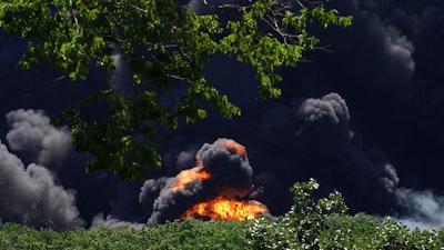 Flames and smoke are seen from an explosion at a chemical plant in Rockton, Ill., Monday, June 14, 2021.