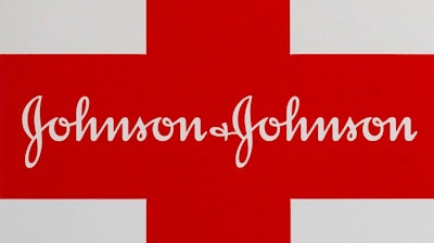 This Feb. 24, 2021 photo shows a Johnson & Johnson logo on the exterior of a first aid kit in Walpole, Mass. The New York attorney general says Johnson & Johnson has agreed to pay $230 million to settle claims that the pharmaceutical giant helped fuel the opioid crisis. The deal requires Johnson & Johnson to make a series of payments over nine years to cover total.