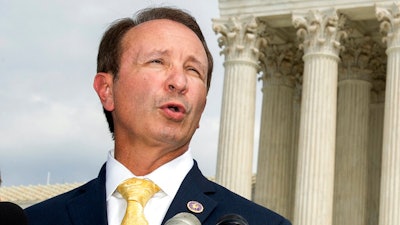 In this Sept. 9, 2019, file photo, Louisiana Attorney General Jeff Landry speaks in front of the U.S. Supreme Court in Washington. The Biden administration’s suspension of new oil and gas leases on federal land and water was blocked Tuesday, June 15, 2021, by a federal judge in Louisiana. U.S. District Judge Terry Doughty's ruling came in a lawsuit filed in March by Louisiana’s Republican attorney general, Jeff Landry and officials in 12 other states. Doughty's ruling granting a preliminary injunction to those states said his order applies nationwide.