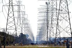 This Tuesday, Feb. 16, 2021 file photo shows power lines in Houston. The electric power grid manager for most of Texas has issued its first conservation alert of the summer, calling on users to dial back energy consumption to avert an emergency. The Energy Reliability Council of Texas issued the alert shortly after midday Monday, saying many forced generation outages and potential record June demand is squeezing the power supply.