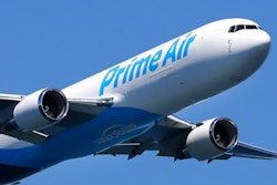 In this Friday, Aug. 5, 2016, file photo, a Boeing 767 with an Amazon.com 'Prime Air' livery flies over Lake Washington, as part of the Boeing Seafair Air Show. Amazon said Wednesday, June 30, 2021, that its carbon footprint grew 19% last year as it rushed to deliver a surge of online orders during the pandemic.