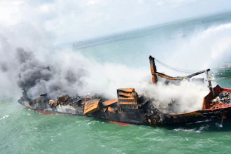 This photo provided by Sri Lankan Air Force shows the sinking MV X-Press Pearl at Kapungoda where it is anchored off Colombo port, Sri Lanka, Wednesday, June 2, 2021. Salvage experts were attempting to tow the fire-stricken container ship that had been loaded with chemicals into the deep sea as the vessel started to sink Wednesday. Water submerged the MV X-Press Pearl's quarterdeck a day after firefighters extinguished a blaze that had been burning for 12 days.