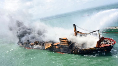 This photo provided by Sri Lankan Air Force shows the sinking MV X-Press Pearl at Kapungoda where it is anchored off Colombo port, Sri Lanka, Wednesday, June 2, 2021. Salvage experts were attempting to tow the fire-stricken container ship that had been loaded with chemicals into the deep sea as the vessel started to sink Wednesday. Water submerged the MV X-Press Pearl's quarterdeck a day after firefighters extinguished a blaze that had been burning for 12 days.