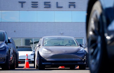This Jan. 24, 2021 photo shows unsold 2021 Model 3 sedan at a Tesla dealership in Littleton, Colo. Tesla’s Model 3 has regained its top safety pick designations from two key groups after losing them recently. On Tuesday, June 29, the IIHS said that it recently completed new evaluations of the camera-based front crash prevention system that comes with certain Tesla Model 3 vehicles.