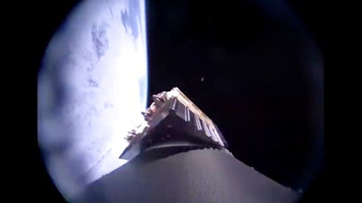 In this image from video made available by Virgin Orbit, the surface of the Earth, left, is seen from the company's LauncherOne rocket during a mission to deliver satellites from three countries into space on Wednesday, June 30, 2021.