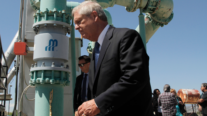 Agriculture Secretary Tom Vilsack tours a tribal wastewater facility on Wednesday, July 7, 2021, in Ohkay Owingeh, New Mexico. Vilsack announced that the Pueblo will receive a $610,000 loan and a $1.6 million grant in state money to expand the wastewater treatment plant where.