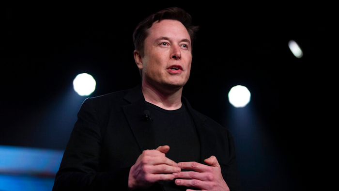 In this March 14, 2019, file photo, Tesla CEO Elon Musk speaks before unveiling the Model Y at the company's design studio in Hawthorne, Calif. In the runup to Tesla Inc.’s 2016 acquisition of SolarCity, Elon Musk called the combination a “no brainer,” a one-stop shop for electric cars and the solar panels to recharge them. On Monday, July 12, 2021, the Tesla CEO will have to defend the $2.5 billion deal under oath in a shareholder lawsuit alleging conflicts of interest.
