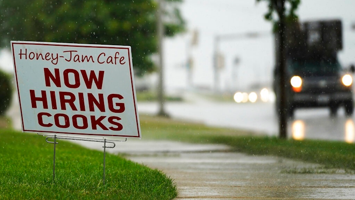 A hiring sign is shown in Downers Grove, Ill., Thursday, June 24, 2021. The number of Americans collecting unemployment benefits slid last week, another sign that the job market continues to recover rapidly from the coronavirus recession.Jobless claims dropped by 24,000 to 400,000 last week, the Labor Department reported Thursday, July 29, 2021.
