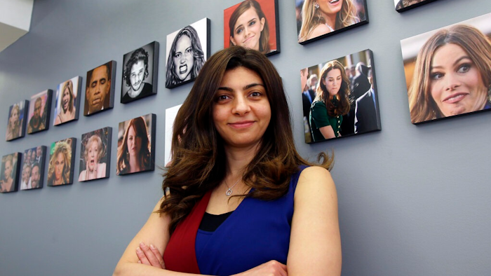 This April 23, 2018 file photo shows Rana el Kaliouby, CEO of the Boston-based artificial intelligence firm, Affectiva, poses in Boston. El Kaliouby has a new job, deputy CEO of Smart Eye — after the Swedish eye-tracking company bought Affectiva for $73.5 million in June 2021. Carmakers are looking to companies like Smart Eye as they brace for new safety rules and standards around the world that could require dashboard cameras to detect dangerous driver behavior in semi-autonomous vehicles.