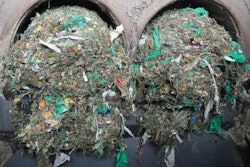 Plastic residue being filtered out of food waste collected in Norway after fermentation to biogas and soil fertilizer.