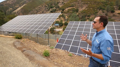 Program lead Bennett Chabot stands by Pacific Gas & Electric's new Remote Grid Initiative site near Yosemite National Park in Briceburg, Calif., June 7, 2021.