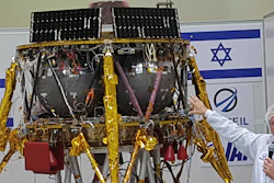 Opher Doron, general manager of Israel Aerospace Industries' space division, speaks beside the SpaceIL lunar module, July 10, 2018, near Tel Aviv.