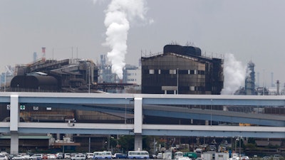 Smoke billows from an oil refinery in Kawasaki, Tokyo, Oct. 21, 2013.