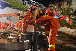 In this photo released by Xinhua News Agency, rescuers prepare equipment as they search for survivors at a collapsed hotel in Suzhou in eastern China's Jiangsu Province on Monday, July 12, 2021. The hotel building collapsed Monday afternoon.