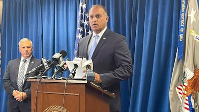 Acting U.S. Attorney Vipal J. Patel, center, accompanied by FBI Special Agent in Charge Chris Hoffman, speaks during a news conference in Cincinnati, Thursday, July 22, 2021. Federal authorities say Akron-based FirstEnergy Corp. would pay a $230 million penalty and fully cooperate as part of an agreement announced Thursday to settle federal charges against the company in a sweeping bribery scheme in Ohio.