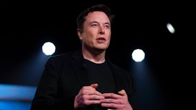 In this March 14, 2019, file photo, Tesla CEO Elon Musk speaks before unveiling the Model Y at the company's design studio in Hawthorne, Calif. In the runup to Tesla Inc.’s 2016 acquisition of SolarCity, Elon Musk called the combination a “no brainer,” a one-stop shop for electric cars and the solar panels to recharge them. On Monday, July 12, 2021, the Tesla CEO will have to defend the $2.5 billion deal under oath in a shareholder lawsuit alleging conflicts of interest.