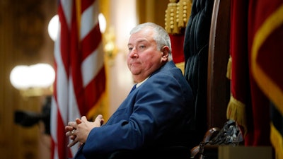 In this Wednesday, Oct. 30, 2019, file photo, Republican Ohio state Rep. Larry Householder sits at the head of a legislative session as Speaker of the House, in Columbus. Householder is charged in a $60 million bribery case, alleging he helped a $1 billion nuclear plant bailout. The 2020 arrests of Householder and four associates in connection with the scheme have rocked politics and business across Ohio.