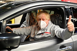 British Prime Minister Boris Johnson visits the Nissan Motor Co. plant, in Sunderland, England, Thursday, July 1, 2021. Japanese carmaker Nissan and two partners announced plans to invest 1 billion ($1.4 billion) pounds to produce a new model of an all-electric vehicle and batteries in northeast England.