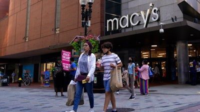 Pedestrians pass the Macy's store in the Downtown Crossing shopping area, Wednesday, July 14, 2021, in Boston. . U.S. retail sales rose a seasonal adjusted 0.6% in June from the month before, the U.S. Commerce Department said Friday, July 16.