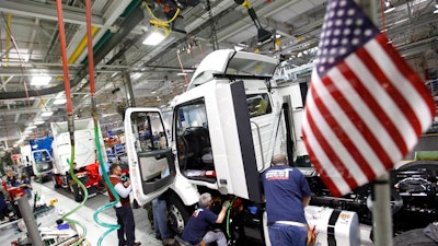 In a Jan. 6, 2011, file photo, workers install parts on a truck on the Volvo truck assembly line at the Volvo plant in Dublin, Va. A tentative labor deal between Volvo Trucks North America and a union representing nearly 3,000 workers who have gone on strike twice in 2021 at the Virginia truck plant was rejected by the striking workers, late Friday, July 9, 2021.