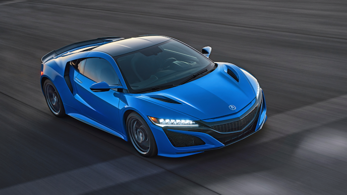 This photo provided by Acura shows the 2021 Acura NSX, an exotic sports car with a hybrid powertrain and sharp handling.