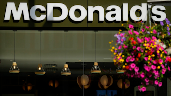 A customer walks in a McDonald's restaurant, in London, Tuesday, Aug. 24, 2021. McDonald&rsquo;s says it has pulled milkshakes from the menu in all 1,250 of its British restaurants because of supply problems stemming from a shortage of truck drivers. The fast-food chain says it is also experiencing shortages of bottled drinks.