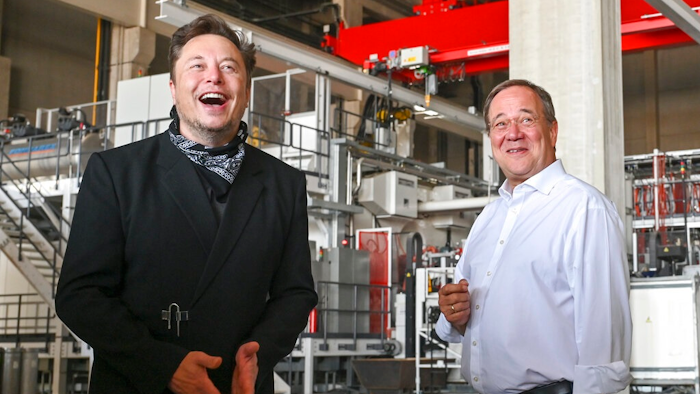 Germany's center-right candidate to replace Angela Merkel as chancellor in the upcoming elections and Christian Democratic Union chairman, Armin Laschet, right, talks to Elon Musk, Tesla CEO, during a visit at the construction side of the Tesla Gigafactory in Gruenheide near Berlin, Germany, Friday, Aug. 13, 2021. Laschest visits the factory as part of his election campaign for the upcoming national elections on Sept. 26, 2021.