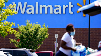 A shopper loads items into her car in the parking lot of a Walmart in Willow Grove, Pa., Wednesday, May 19, 2021. Walmart says it will start commercializing its delivery service, using contract workers, autonomous vehicles and even drones to deliver other retailers' products directly to their customers' homes as fast as just a few hours.