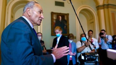 Senate Majority Leader Chuck Schumer, D-N.Y., updates reporters on the infrastructure negotiations between Republicans and Democrats, at the Capitol in Washington on July 28.