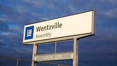 In this March 24, 2021 photo, a sign stands near an entrance to a General Motors assembly plant in Wentzville, Mo.