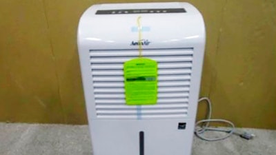 This photo provided by Consumer Product Safety Commission shows a dehumidifier made by New Widetech. The Consumer Product Safety Commission says, Friday, Aug. 6, 2021, about 2 million dehumidifiers made by New Widetech are being recalled in the U.S. because they can overheat and catch fire, posing fire and burn hazards. New Widetech is aware of 107 incidents of the recalled dehumidifiers overheating and/or catching fire, resulting in about $17 million in property damage. No injuries have been reported.
