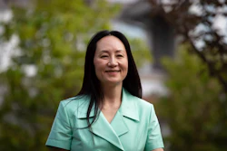 Meng Wanzhou, chief financial officer of Huawei, smiles as she leaves home to attend her extradition hearing at B.C. Supreme Court, in Vancouver, British Columbia, Monday, Aug. 9, 2021.