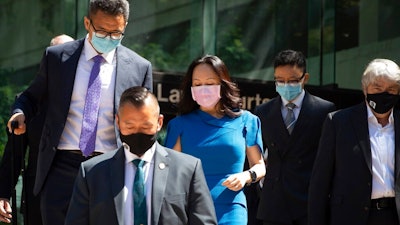 Meng Wanzhou, chief financial officer of Huawei, leaves British Columbia Supreme Court during a break from her extradition hearing, in Vancouver, British Columbia, Wednesday, Aug. 4, 2021.