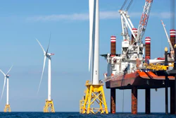 In this March 28, 2018, file photo, a North Atlantic right whale feeds on the surface of Cape Cod bay off the coast of Plymouth, Mass. A group from the island of Nantucket, Mass., called ACK Residents Against Turbines, filed a federal lawsuit Wednesday, Aug. 25, 2021, to block the construction of dozens of wind turbines off the coast of Nantucket and nearby Martha's Vineyard. ACK Residents Against Turbines say Vineyard Wind's proposed project poses a risk to the endangered Northern Atlantic right whale.