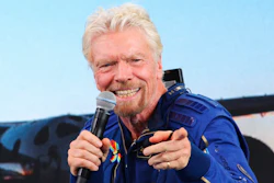 In this Sunday, July 11, 2021 file photo, Richard Branson answers students' questions during a news conference at Spaceport America near Truth or Consequences, N.M. Virgin Galactic is selling tickets for space flights again, just weeks after founder Richard Branson rode a rocket-powered plane to more than 50 miles above the Earth. Tickets aren't cheap. Virgin Galactic is setting prices to start at $450,000 a seat. The company announced the sales as it reported Thursday, Aug. 5, 2021 that it lost $94 million in the second quarter. Costs for overhead and sales jumped from a year earlier. Revenue was just $571,000, barely enough to cover one seat on a future flight.