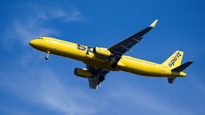 A Spirit Airlines jet approaches Philadelphia International Airport in Philadelphia, Wednesday, Feb. 24, 2021. On Monday, Aug. 16, 2021, Spirit said the cancellation of more than 2,800 flights over an 11-day stretch this summer cost the budget airline about $50 million in lost revenue and caused spending to soar.