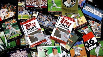 In this March 6, 2007 file photo, Topps baseball cards are seen in Boston. Major League Baseball is ending its 70-year relationship with trading card company Topps, Thursday, Aug. 19, 2021, and will instead be working sports merchandise company Fanatics.