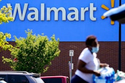 A shopper loads items into her car in the parking lot of a Walmart in Willow Grove, Pa., Wednesday, May 19, 2021. Walmart says it will start commercializing its delivery service, using contract workers, autonomous vehicles and even drones to deliver other retailers' products directly to their customers' homes as fast as just a few hours.