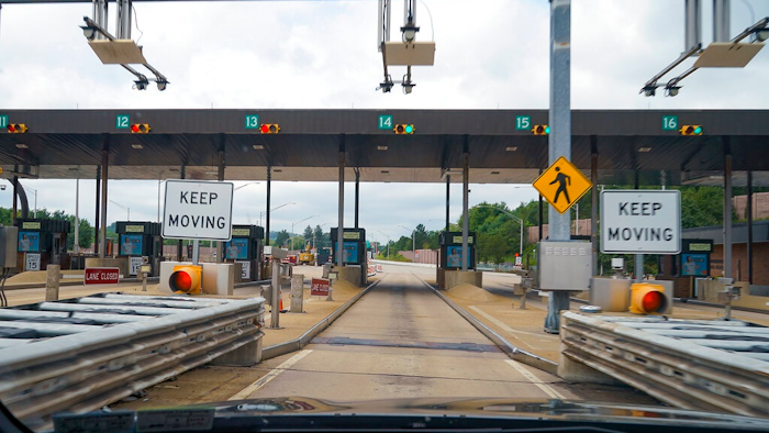 In this photo made through a windshield, the sensors and lights are seen at the west bound toll gate of the Pennsylvania Turnpike in Cranberry Township, Pa., on Monday, Aug. 30, 2021. More than $104 million in Pennsylvania Turnpike tolls went uncollected last year as the agency fully converted to all-electronic tolling. Turnpike records show the millions of motorists who don’t use E-ZPass have a nearly 1 in 2 chance of riding without paying under the “toll-by-plate” license plate reader system.