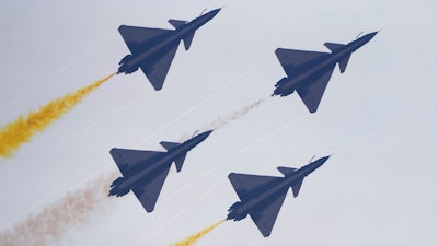 Members of the 'August 1st' Aerobatic Team of the Chinese People's Liberation Army (PLA) Air Force perform during the 13th China International Aviation and Aerospace Exhibition, also known as Airshow China 2021, on Tuesday, Sept. 28, 2021, in Zhuhai in southern China's Guangdong province.