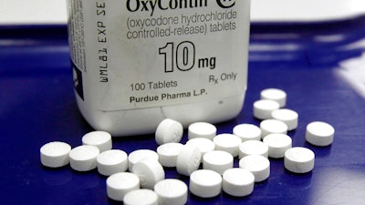 This Feb. 19, 2013, file photo shows OxyContin pills arranged for a photo at a pharmacy in Montpelier, Vt. A federal bankruptcy judge is expected to rule Wednesday, Sept. 1, 2021, on whether to accept a settlement between OxyContin maker Purdue Pharma, the states and thousands of local governments over an opioid crisis that has killed a half-million Americans over the last two decades.