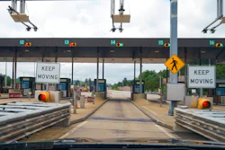In this photo made through a windshield, the sensors and lights are seen at the west bound toll gate of the Pennsylvania Turnpike in Cranberry Township, Pa., on Monday, Aug. 30, 2021. More than $104 million in Pennsylvania Turnpike tolls went uncollected last year as the agency fully converted to all-electronic tolling. Turnpike records show the millions of motorists who don’t use E-ZPass have a nearly 1 in 2 chance of riding without paying under the “toll-by-plate” license plate reader system.