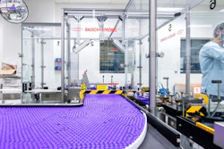 In this March 2021 photo provided by Pfizer, a technician works on a line for packaging preparation for the Pfizer-BioNTech COVID-19 vaccine at the company's facility in Puurs, Belgium. Billions more in profits are at stake for some vaccine makers as the U.S. moves toward dispensing COVID-19 booster shots to shore up Americans' protection against the virus.