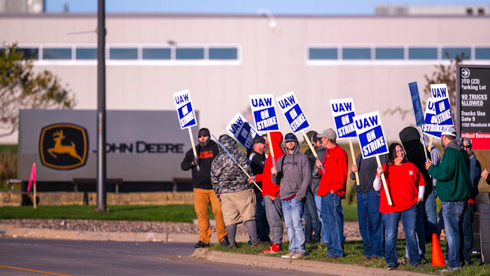 John Deere Drivetrain Operations workers in Waterloo, Iowa, stand on the picket line at the plant as the UAW officially started its strike on Oct. 14.