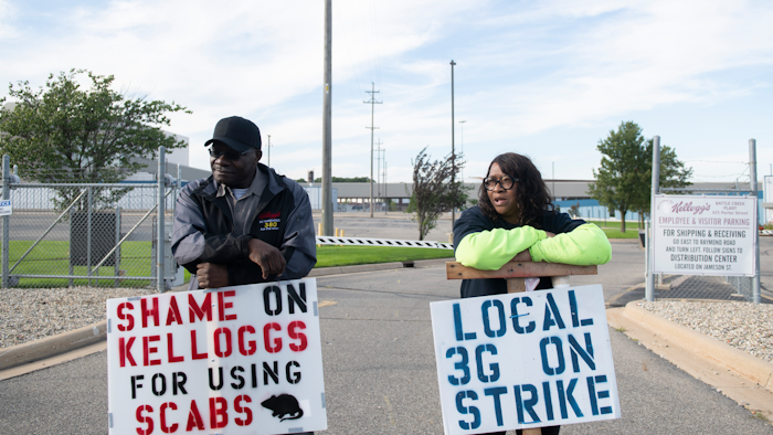Larry Gamble, who has worked at the Kellogg plant for 13 years, and Sharnita Childress, who has worked at the plant for 8 years, picket with other union workers outside of the plant in Battle Creek, Mich. on Tuesday, Oct. 19, 2021. Around 1,400 union workers from Michigan, Tennessee, Pennsylvania and Nebraska have been on strike for the past two weeks.