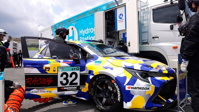 This photo released by Toyota Motor Corp., shows a hydrogen engine car being refueled during the five-hour-long Super Taikyu Race at Autopolis in Hita, Oita prefecture, southern Japan on July 31, 2021. Toyota said Monday, Oct. 25, 2021 it is testing hydrogen combustion engines in race cars as it works toward using the technology in commercial products.