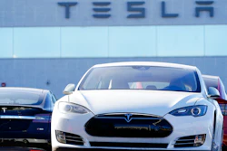 An unsold 2021 S70 sedan at a Tesla dealership.